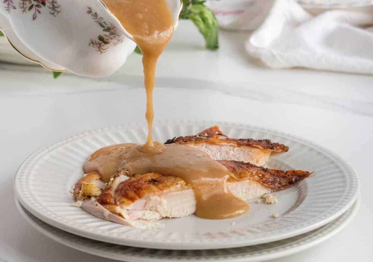 turkey gravy poured onto turkey breast