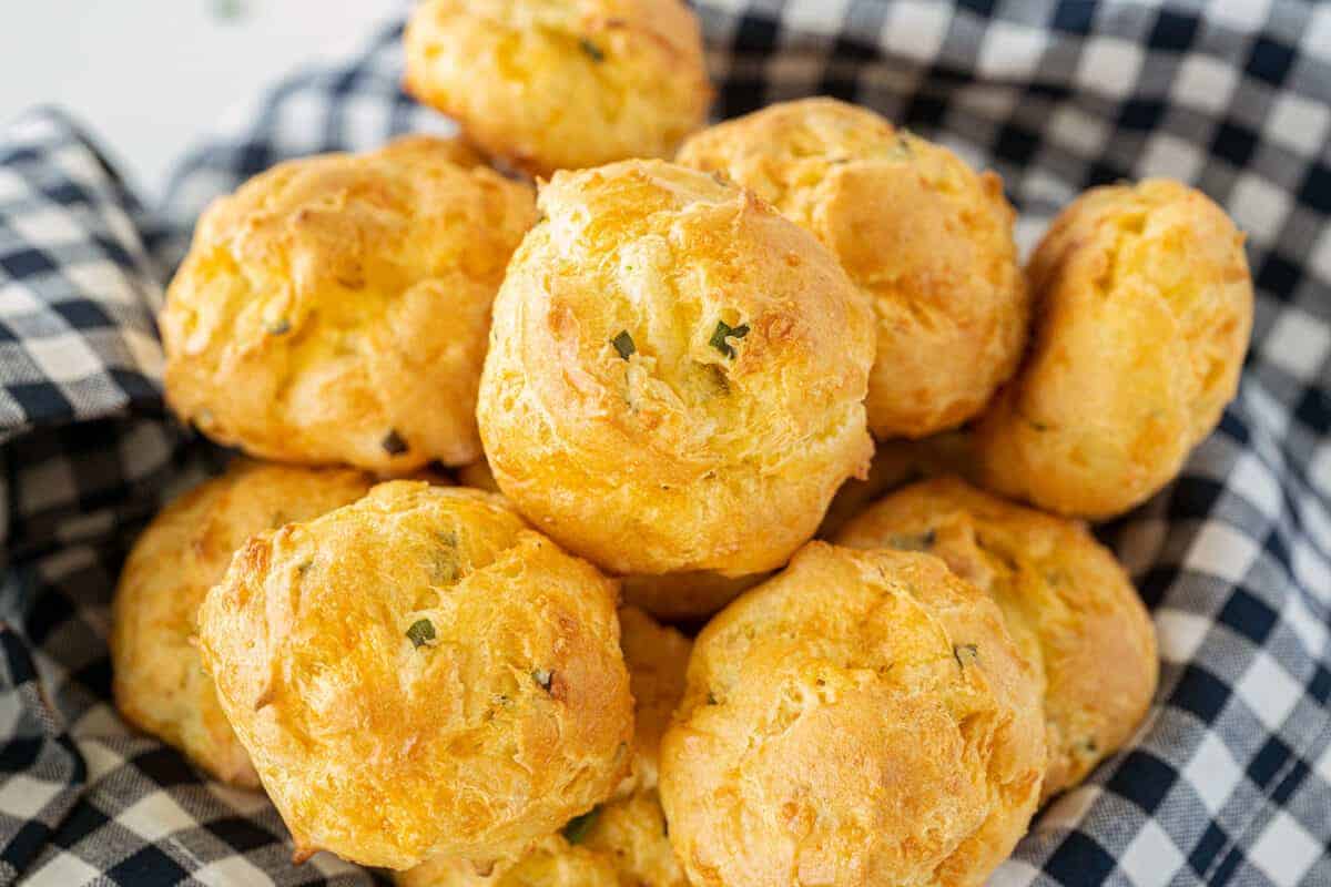 cheese puffs in a pile in a basket
