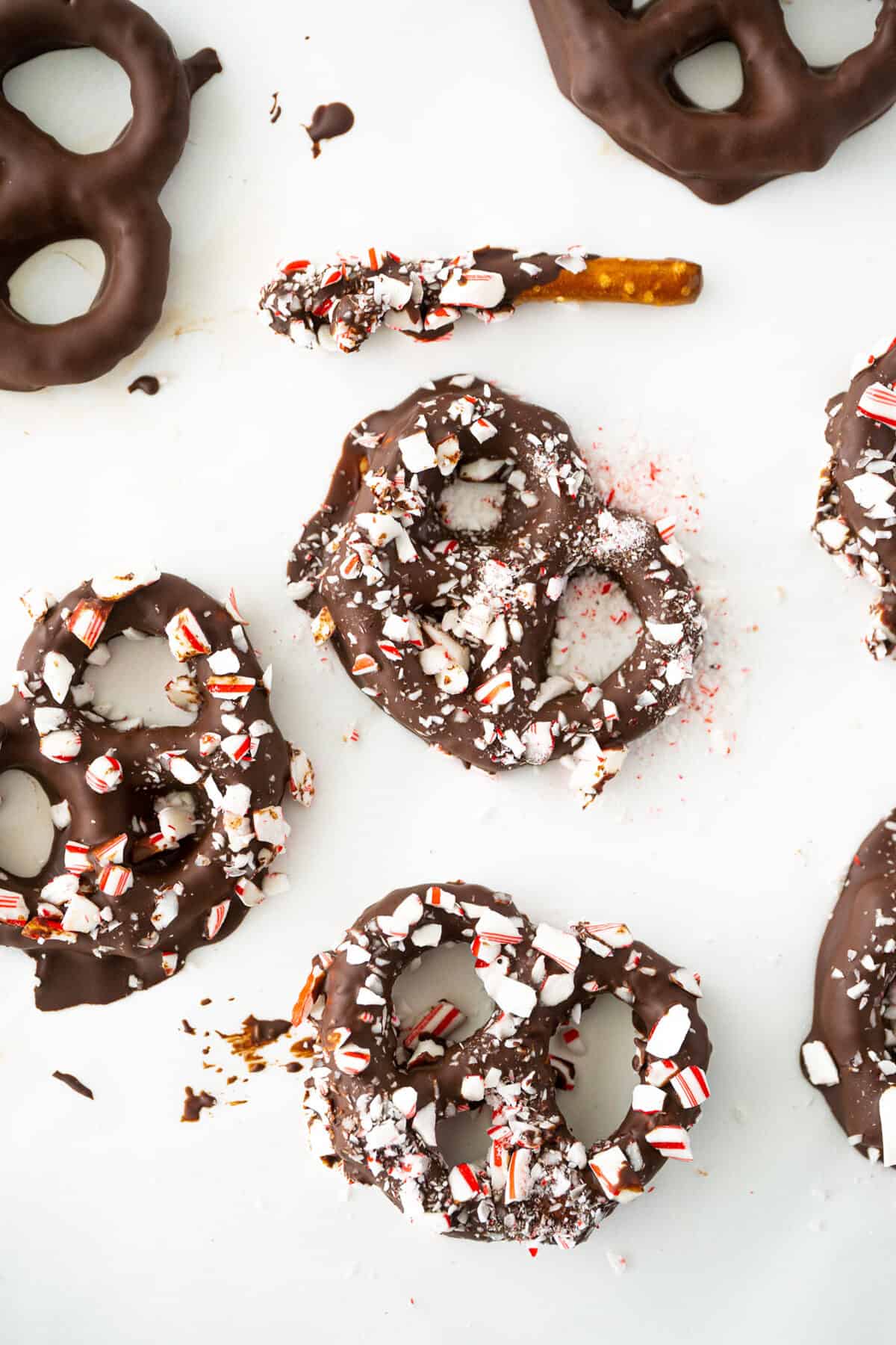 chocolate covered pretzels on a parchment lined baking sheet