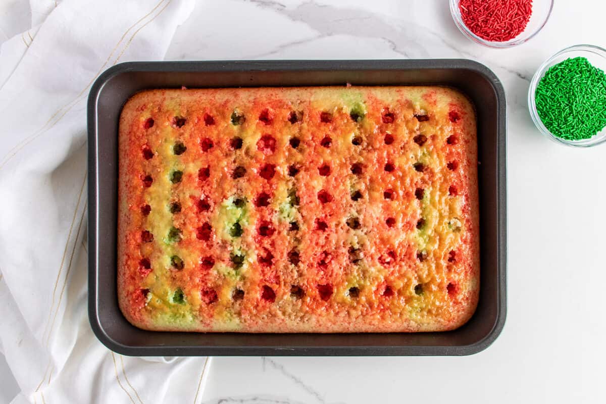 poked holes in white cake with Jello poured in