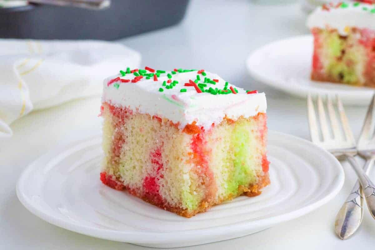 sliced red and green Jello poke cake