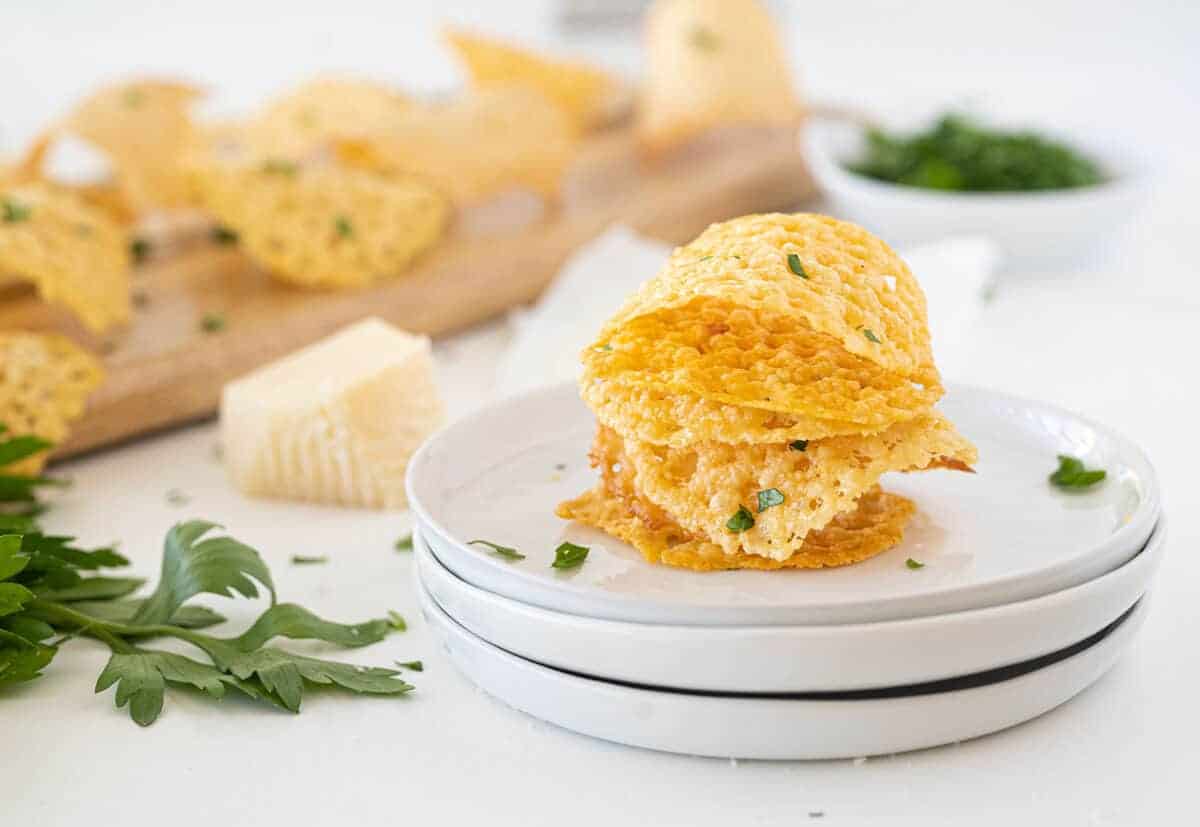 Parmesan crisps on a white plate