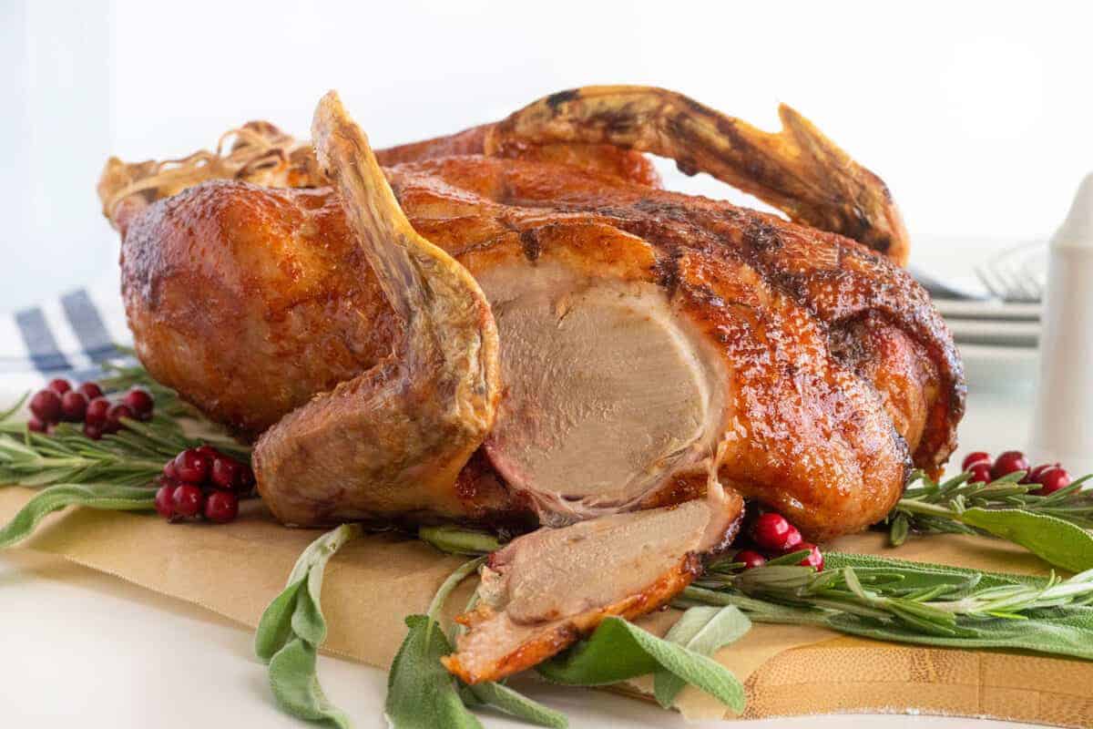 roast duck on a wooden cutting board 