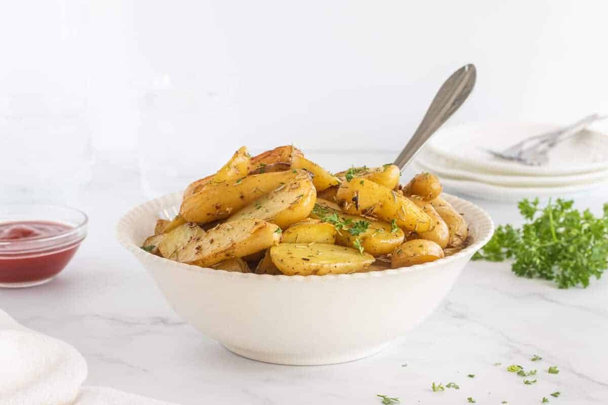 roasted fingerling potatoes in a white bowl