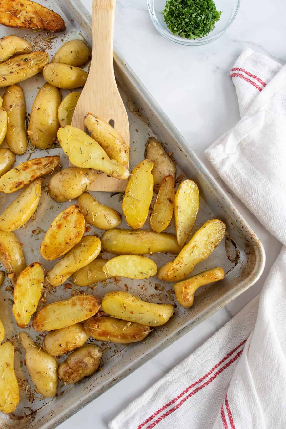 roasted fingerling potatoes on a baking sheet