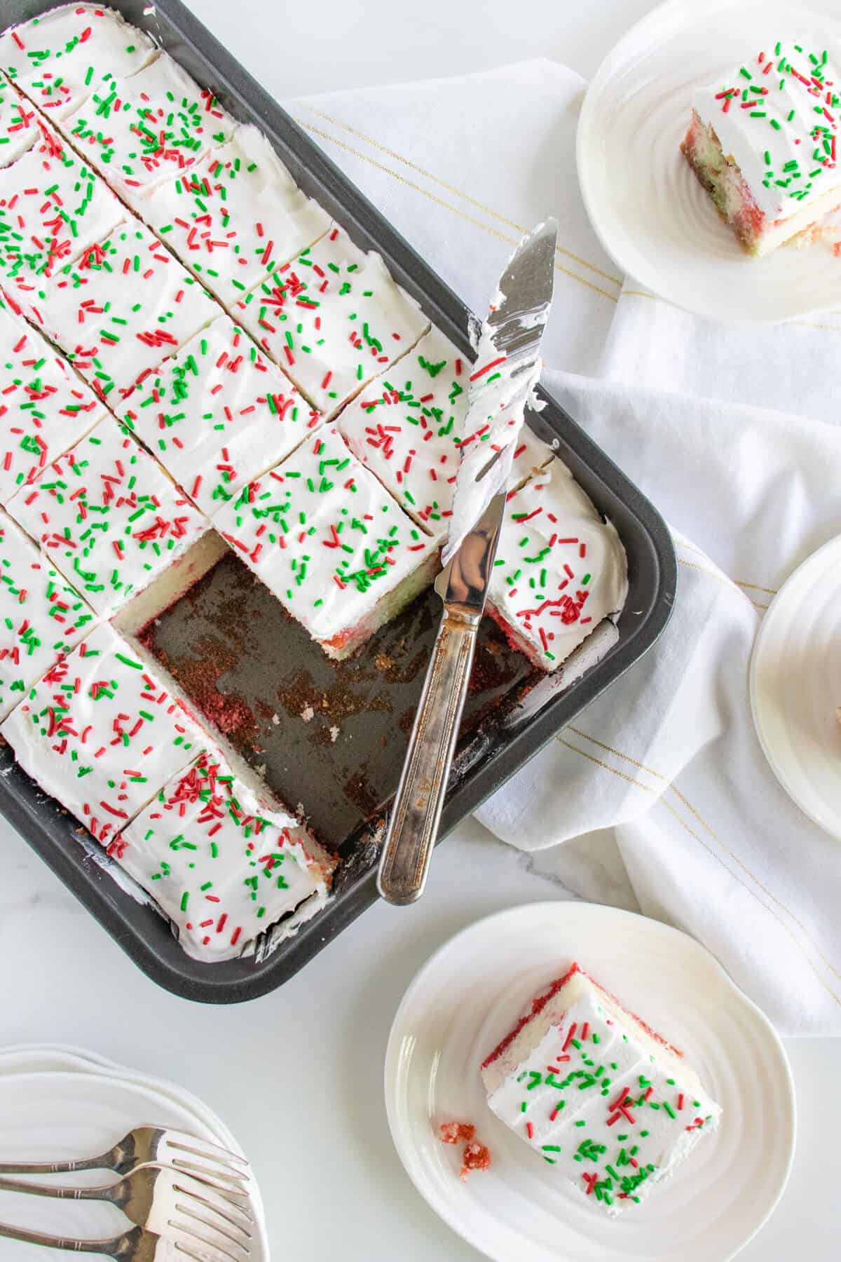 Jello cake frosted with red and green sprinkles 