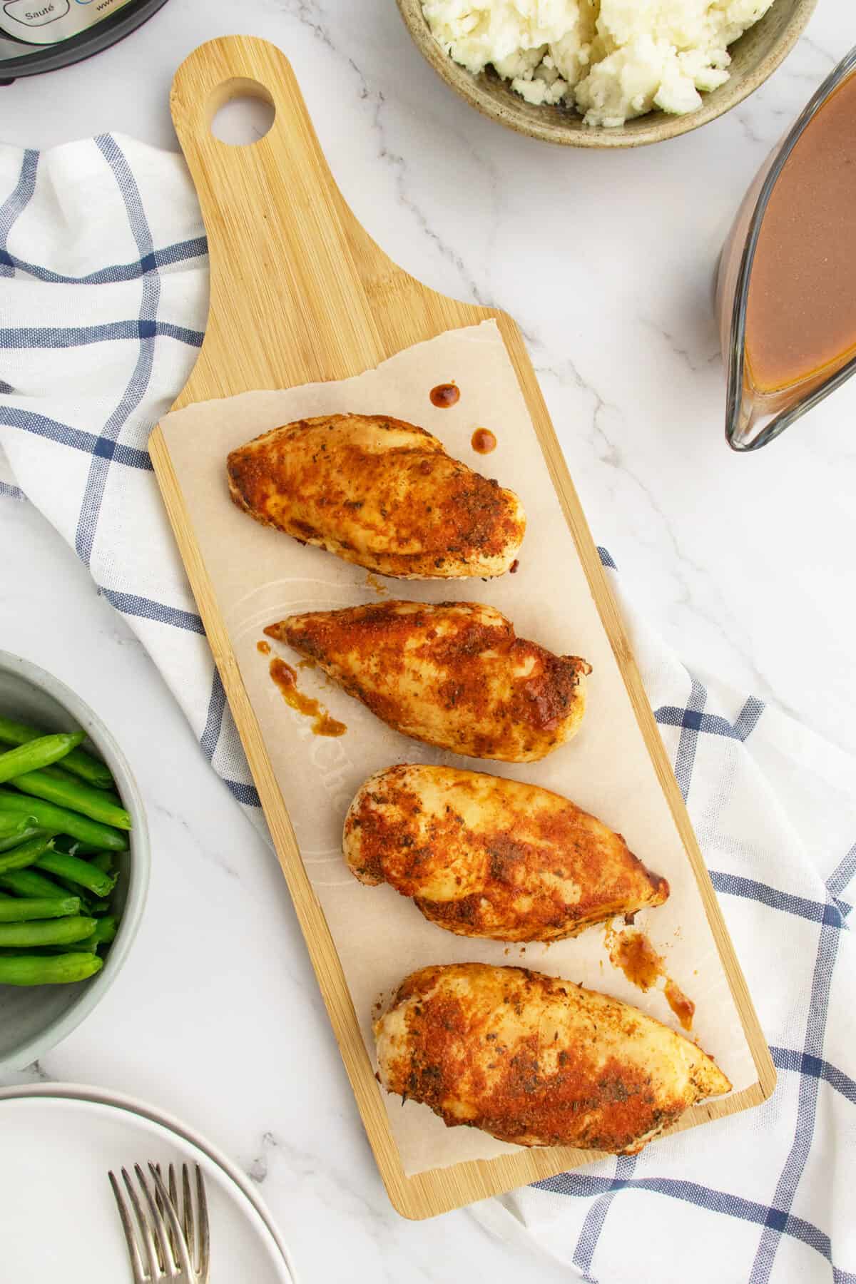 Chicken Breast lined up on cutting board