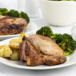 Cooked pork chop on plate with vegetables