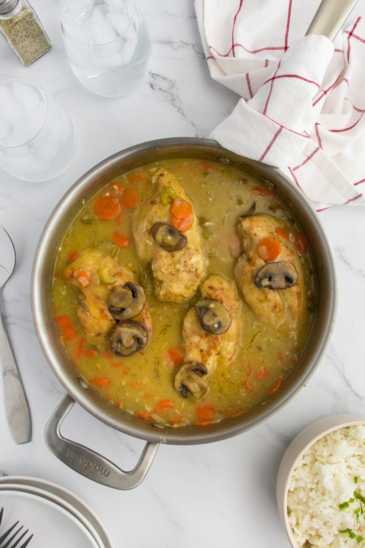 Smothered chicken in skillet