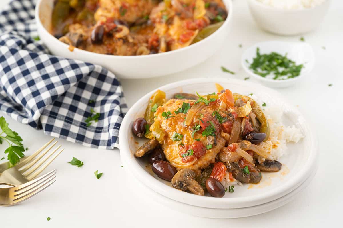 Chicken Marengo in a tomato-based sauce with mushrooms and herbs.