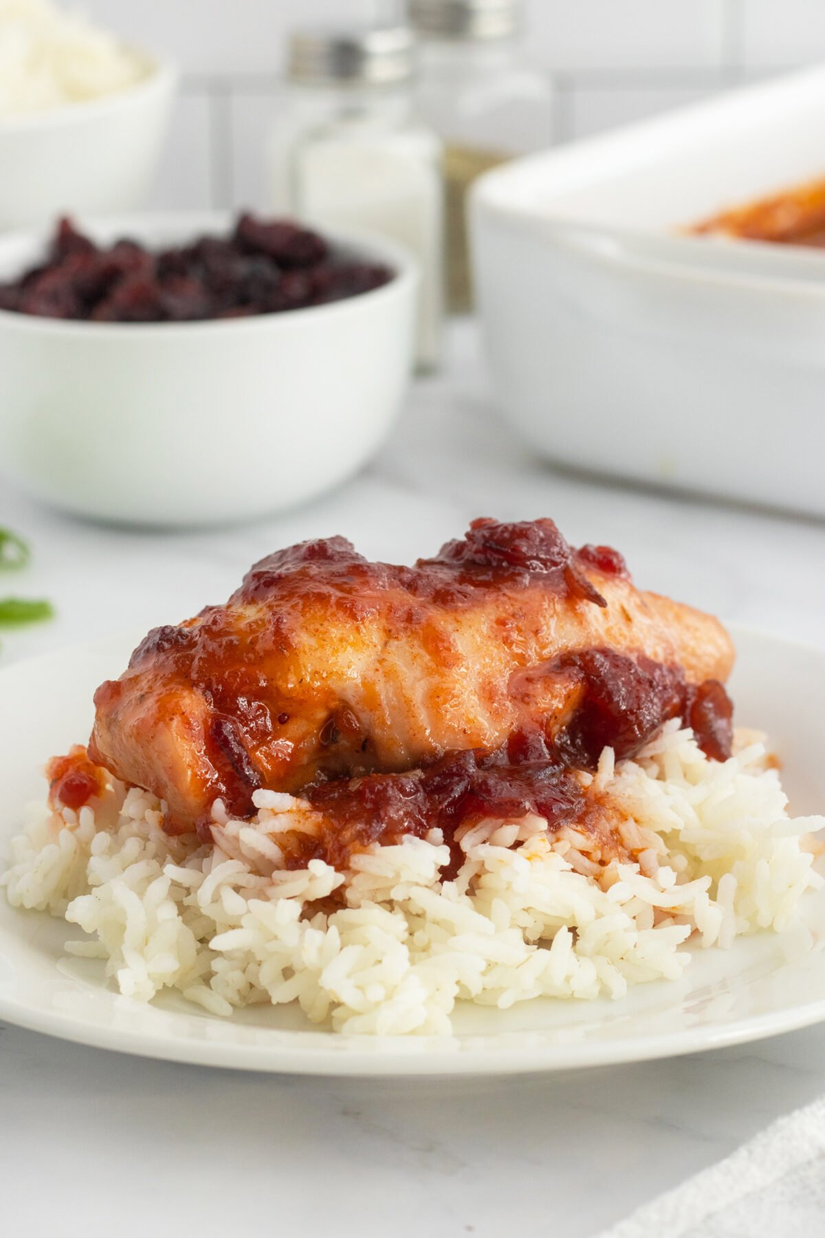Cranberry chicken on rice and plate