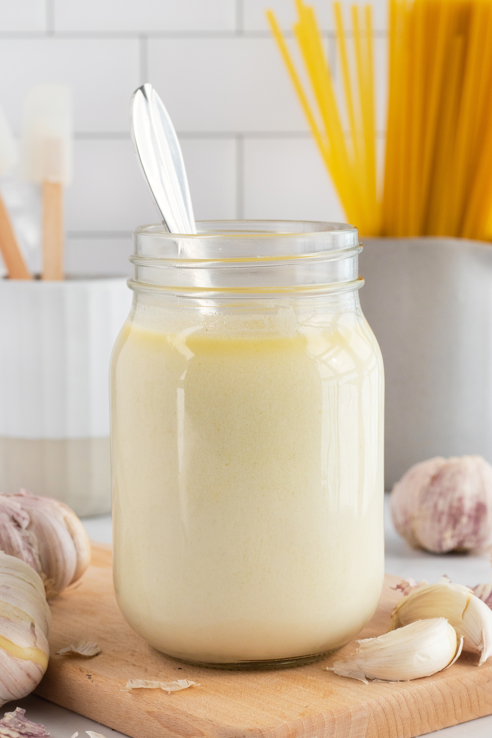 Garlic alfredo in mason jar with spoon