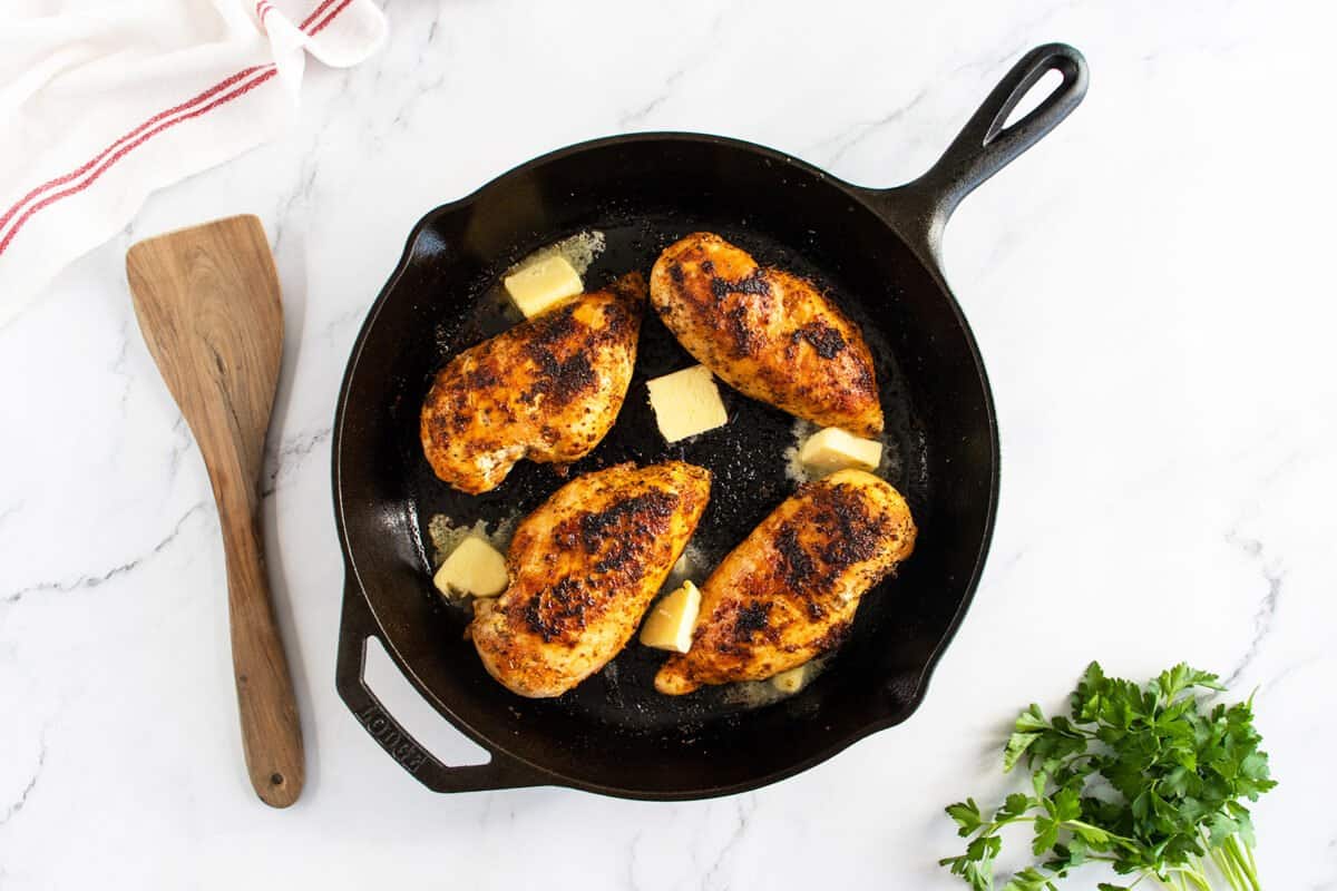Pan fried chicken breast in fying pan