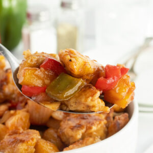 Sweet and sour chicken on spoon