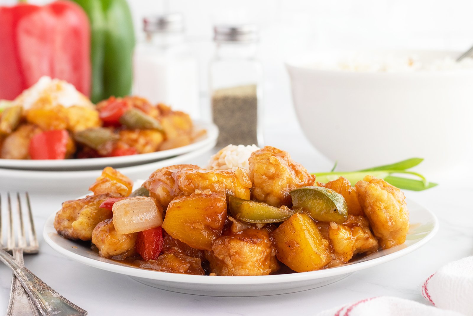 Crispy chicken pieces coated in tangy sweet-and-sour sauce.