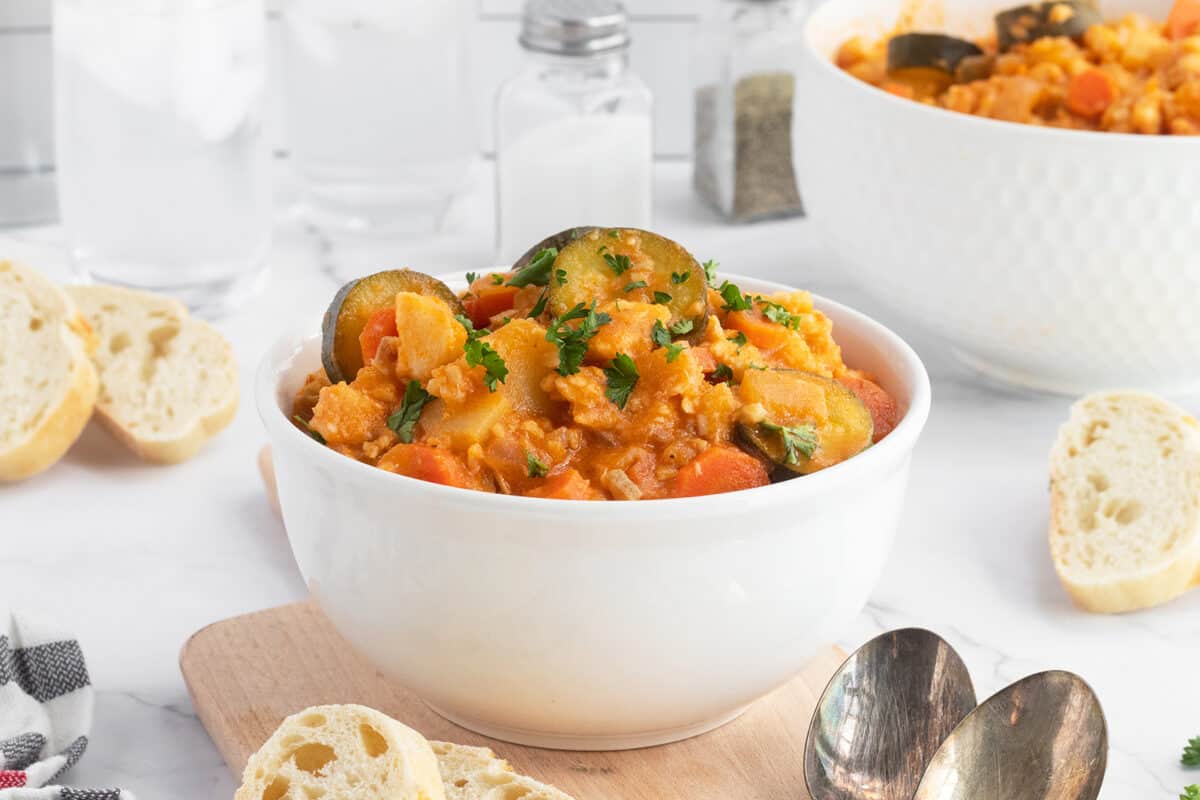 Fish stew in white bowl