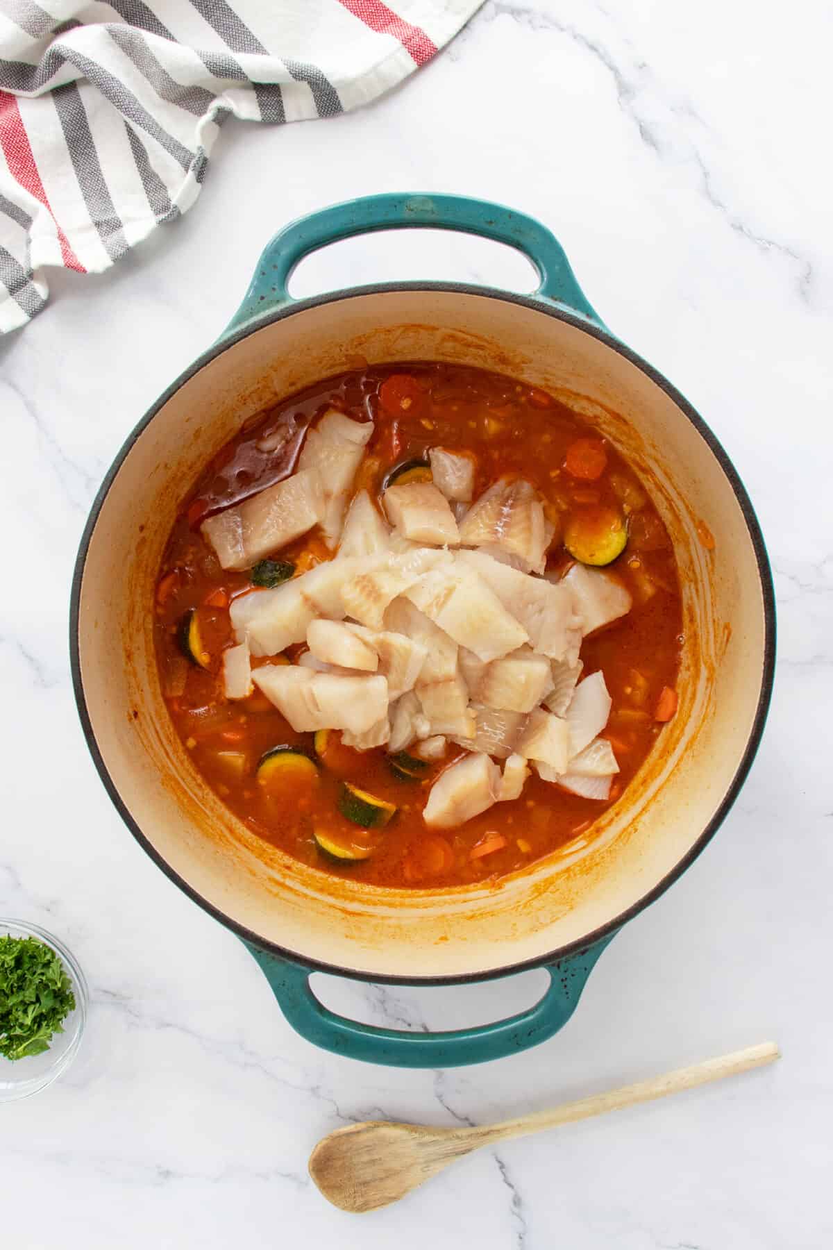 Fish stew in pot with fish