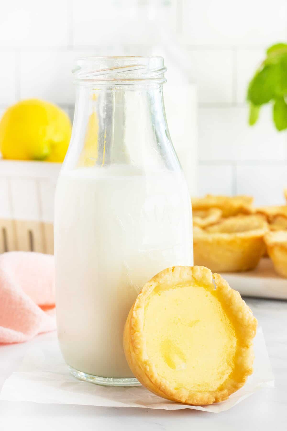 Lemon Tart beside a jar of milk