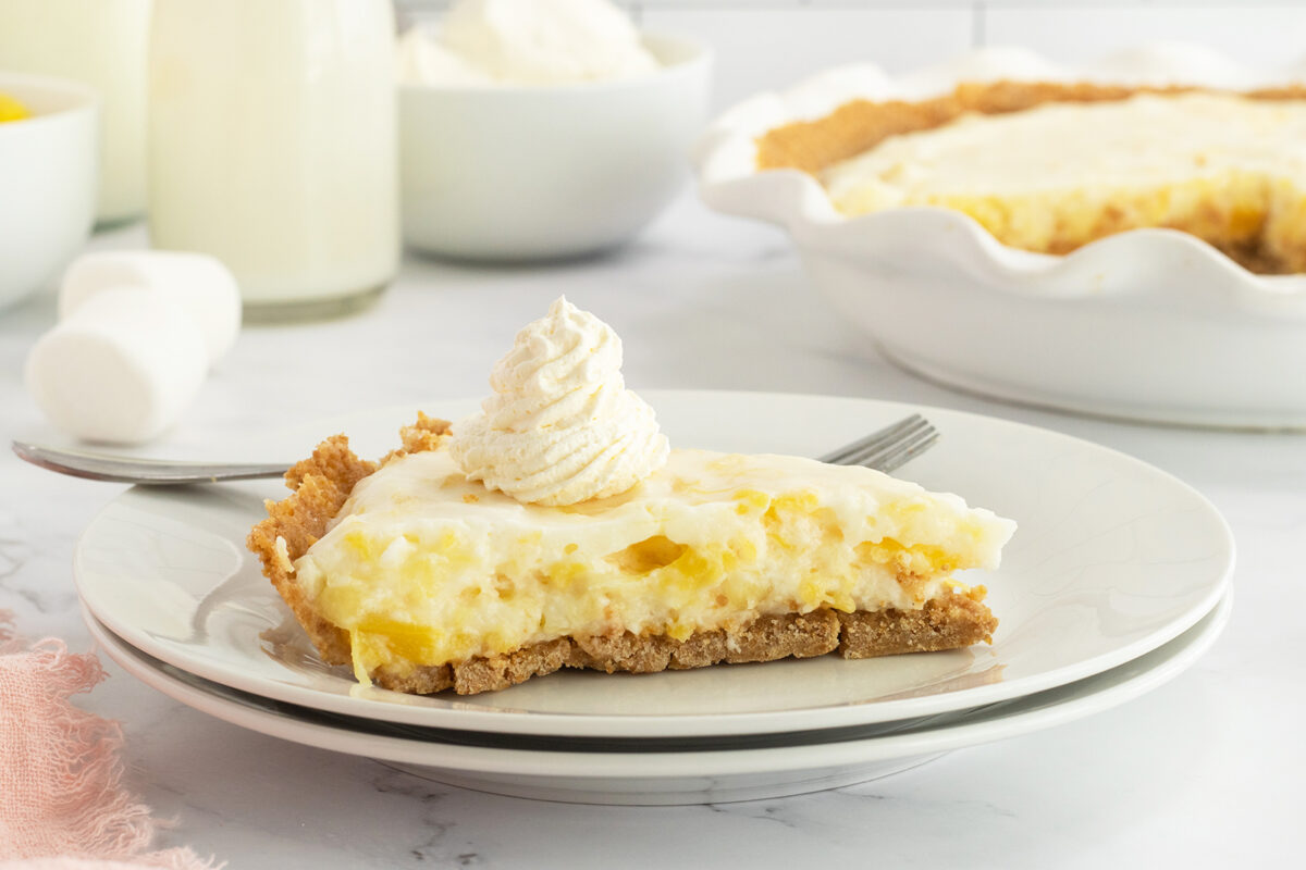 Marshmallow Pineapple Pie on a plate with fork