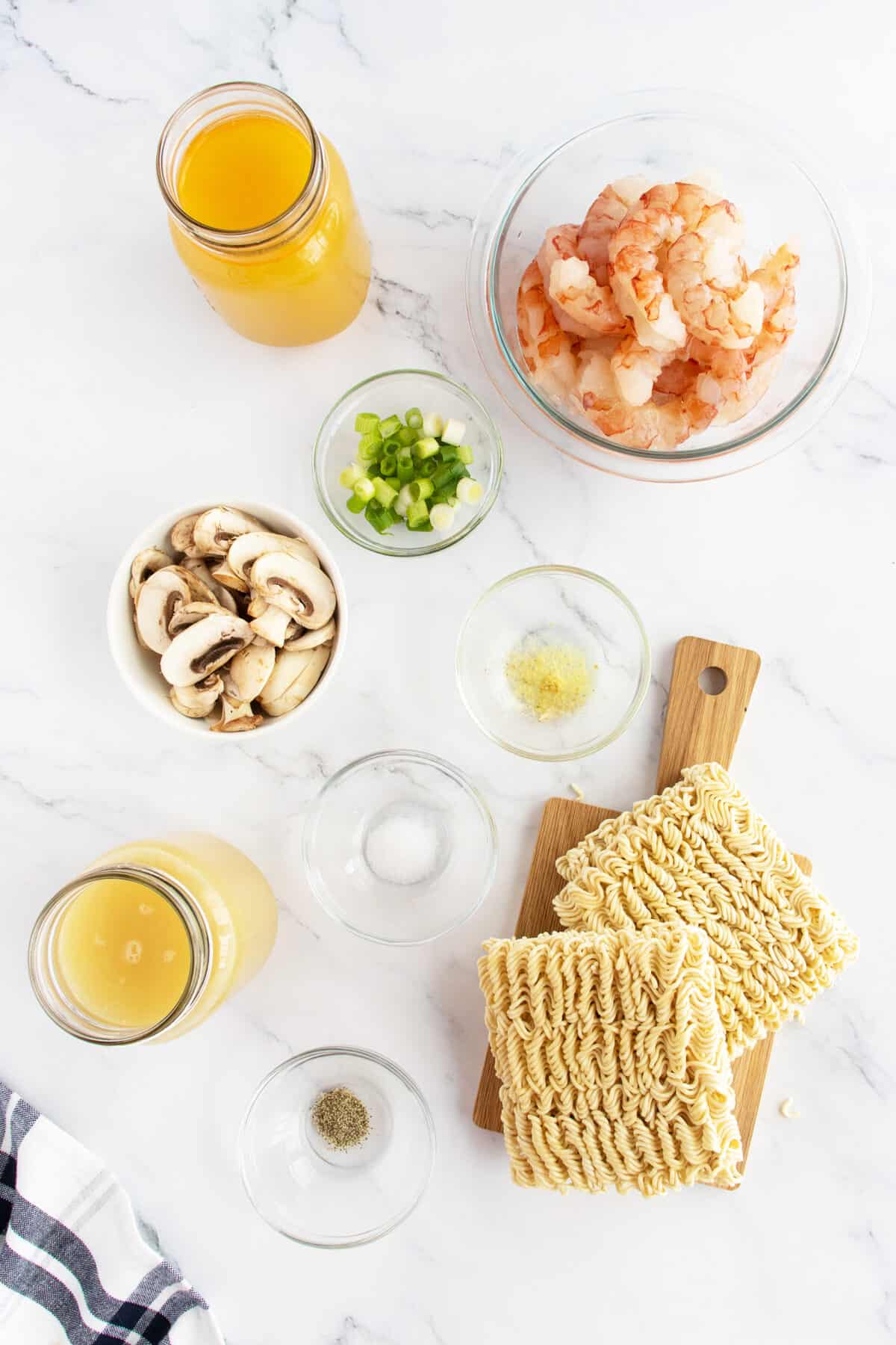 Shrimp soup ingredients on a board