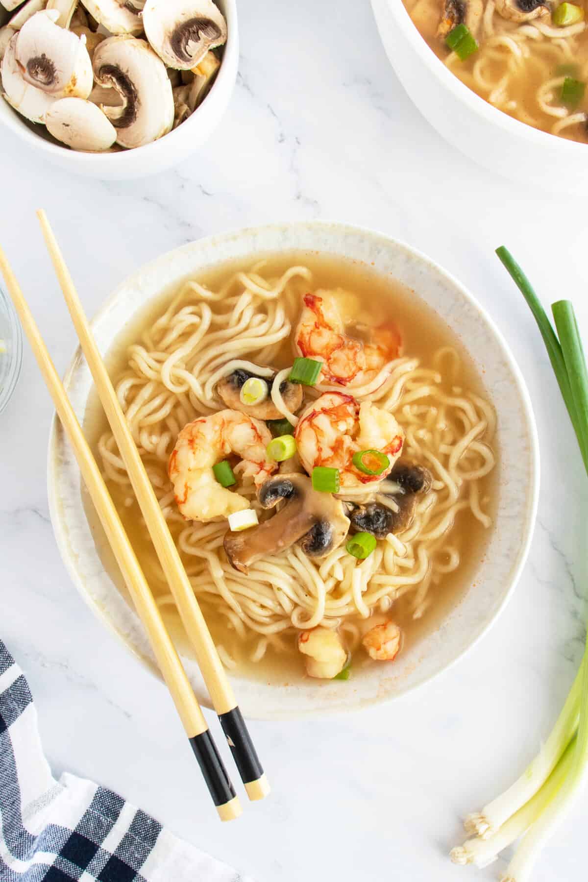 Shrimp soup with chopsticks on top of the bowl