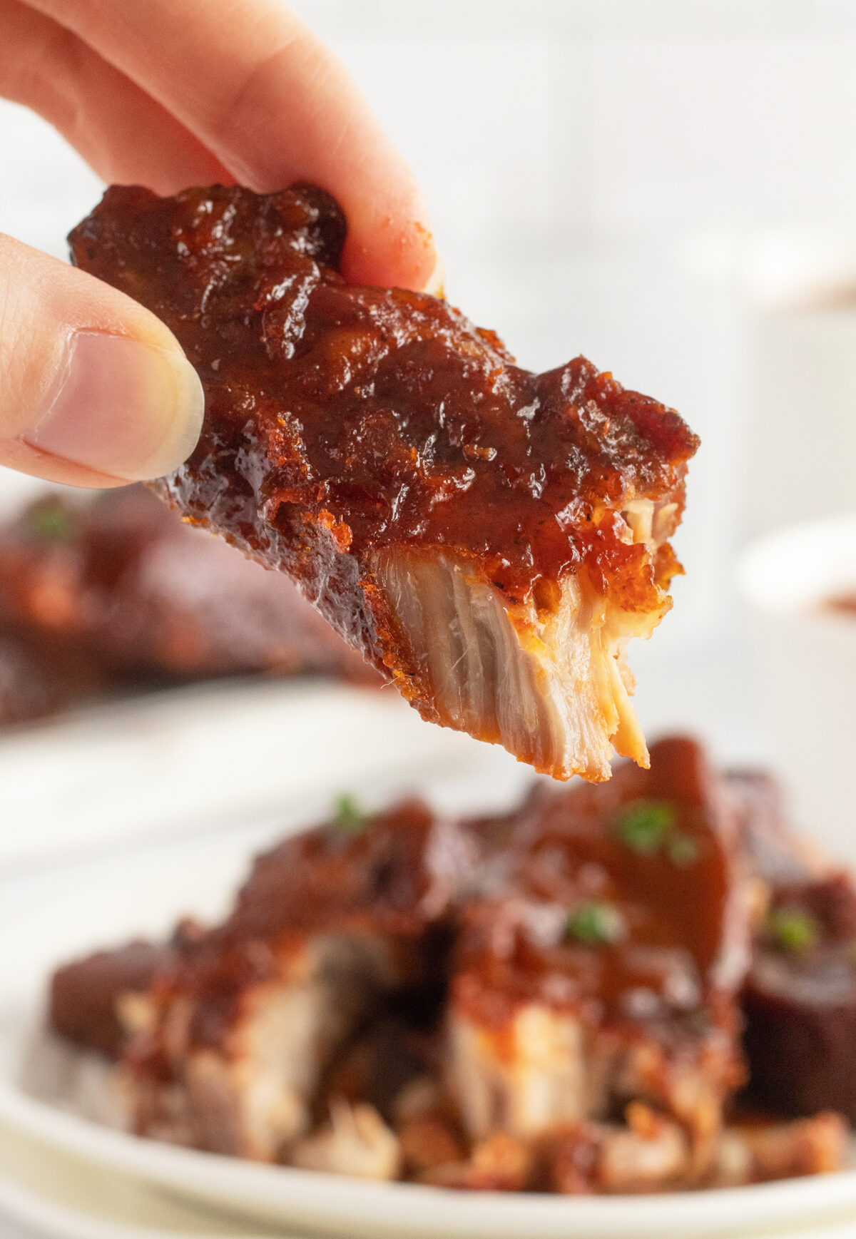 closeup of ribs being held up by hands