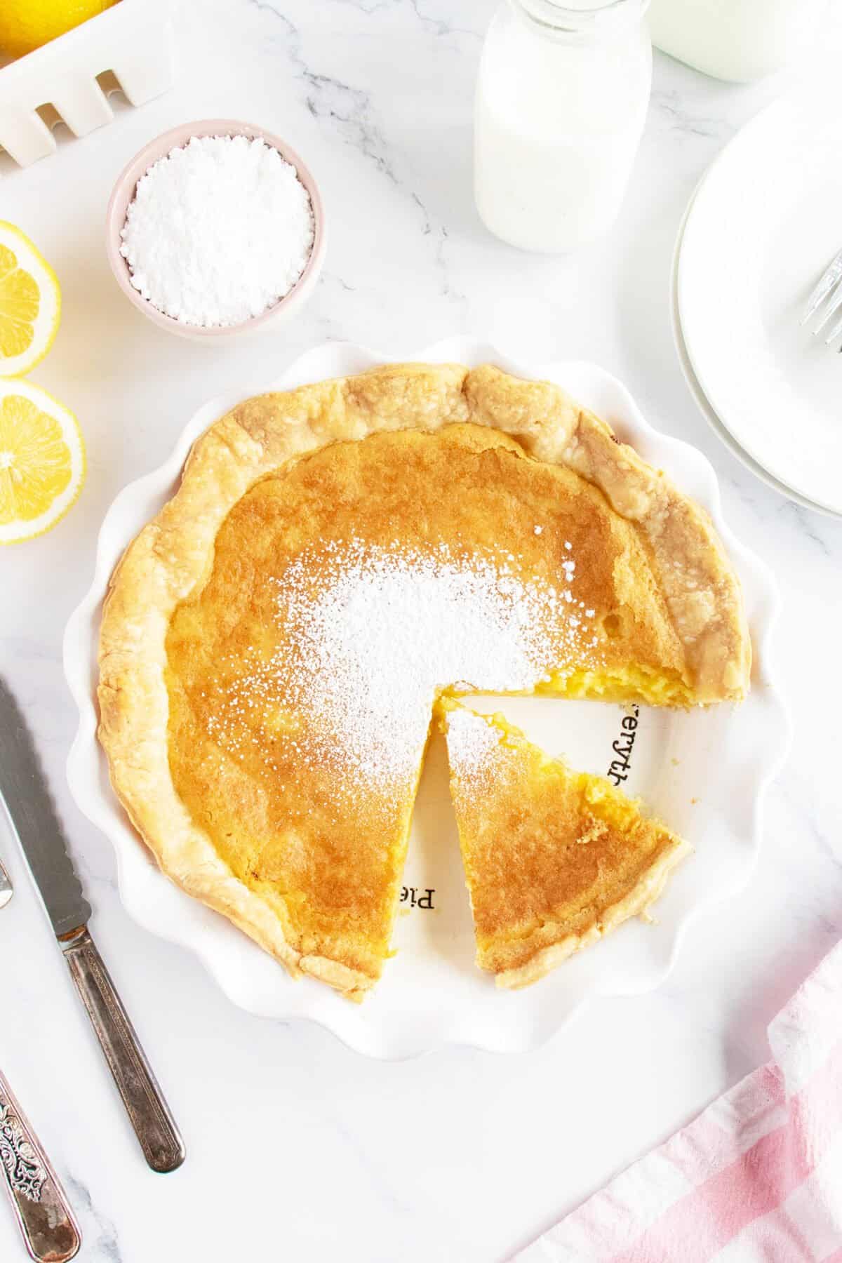 whole Lemon Chess Pie with a slice cut into it