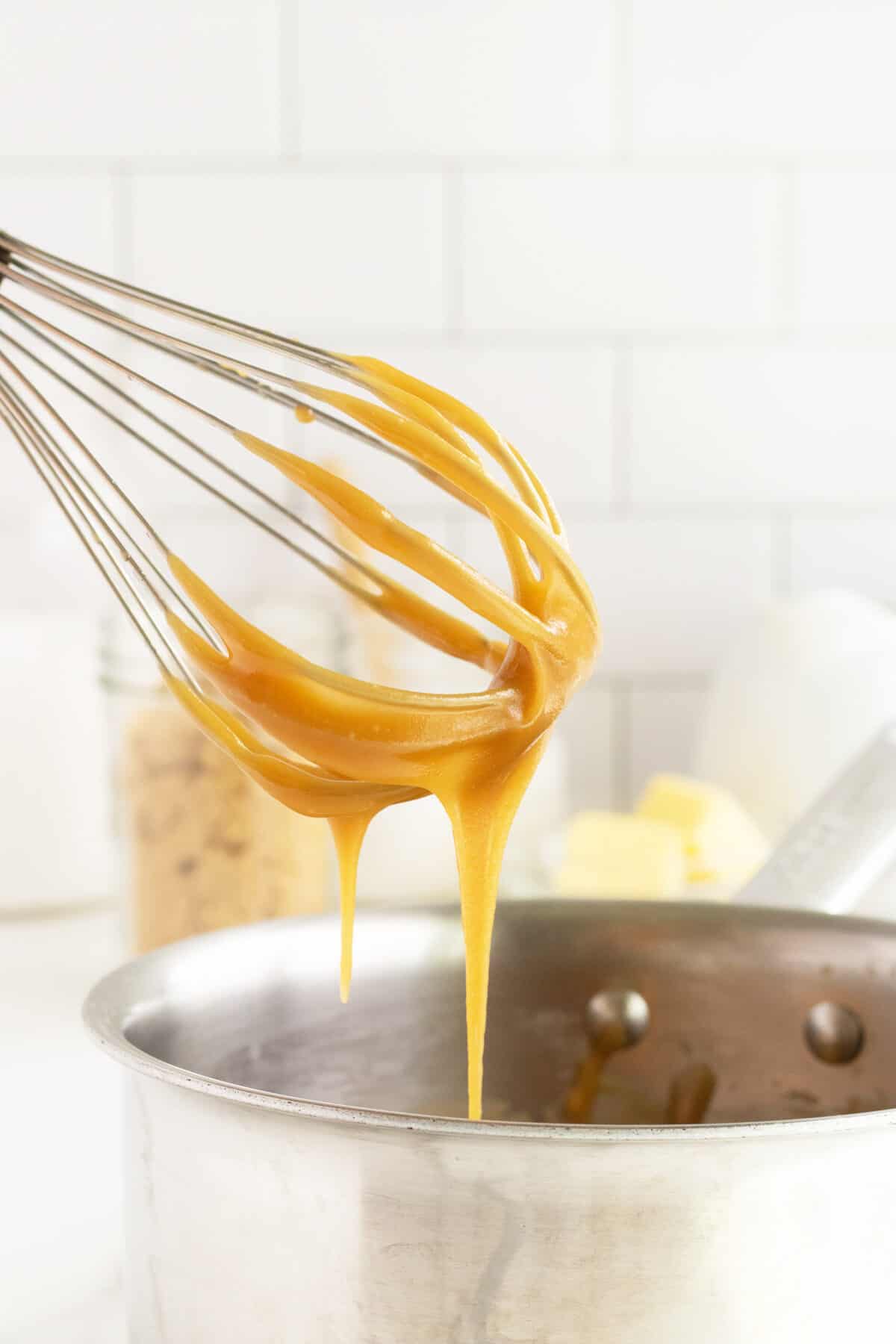 Salted Caramel Sauce dripping off a whisk