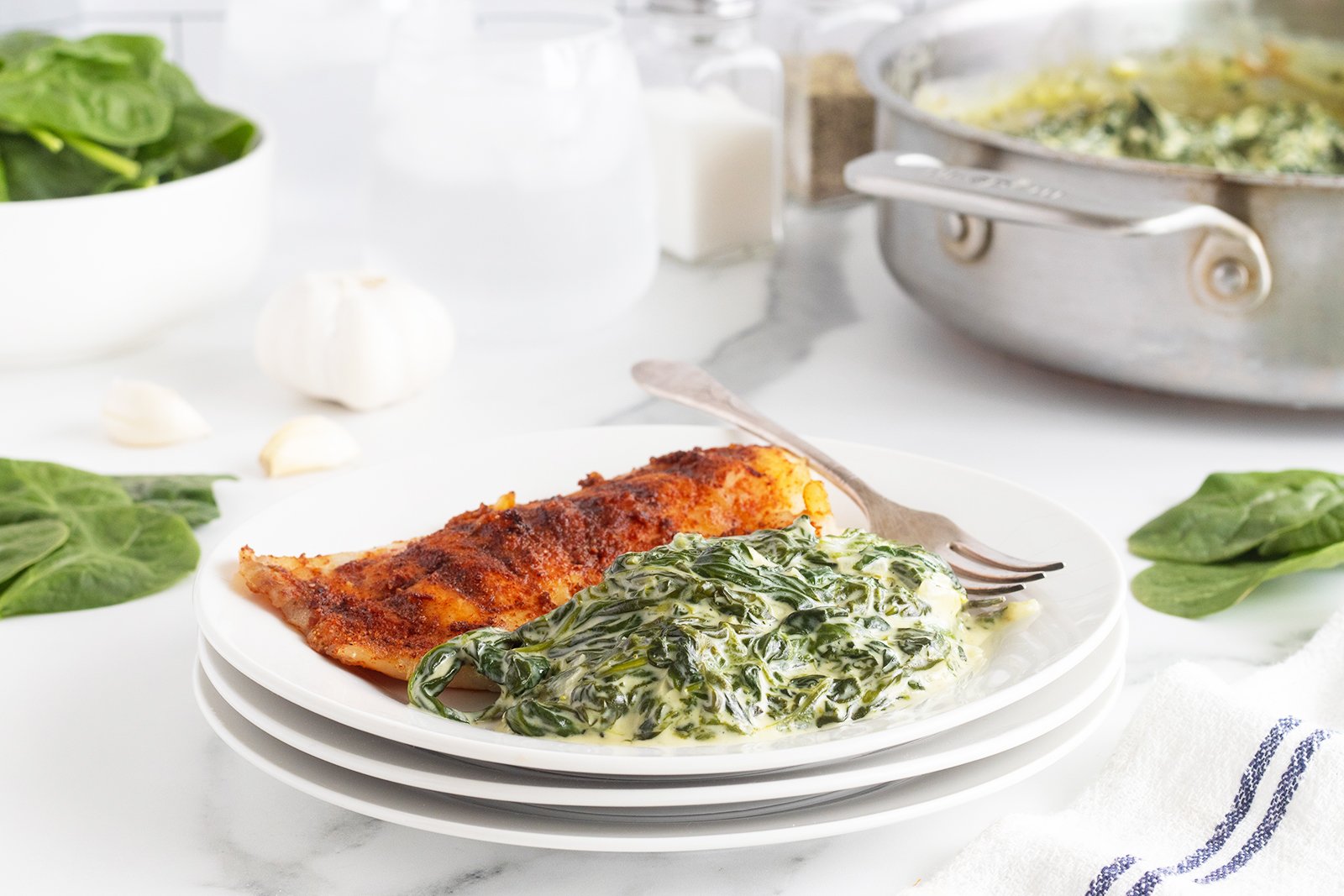 Creamed spinach served with roasted chicken breast.