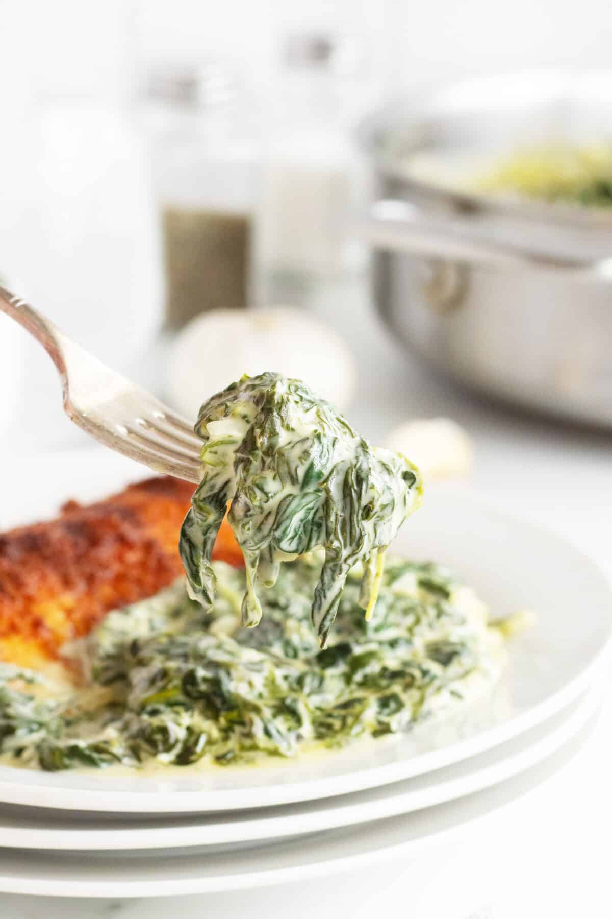 Creamed spinach on a fork