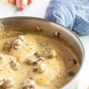 Creamy mushroom Tarragon chicken in pan with sauce and mushrooms