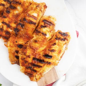 Grilled tilapia on a white platter