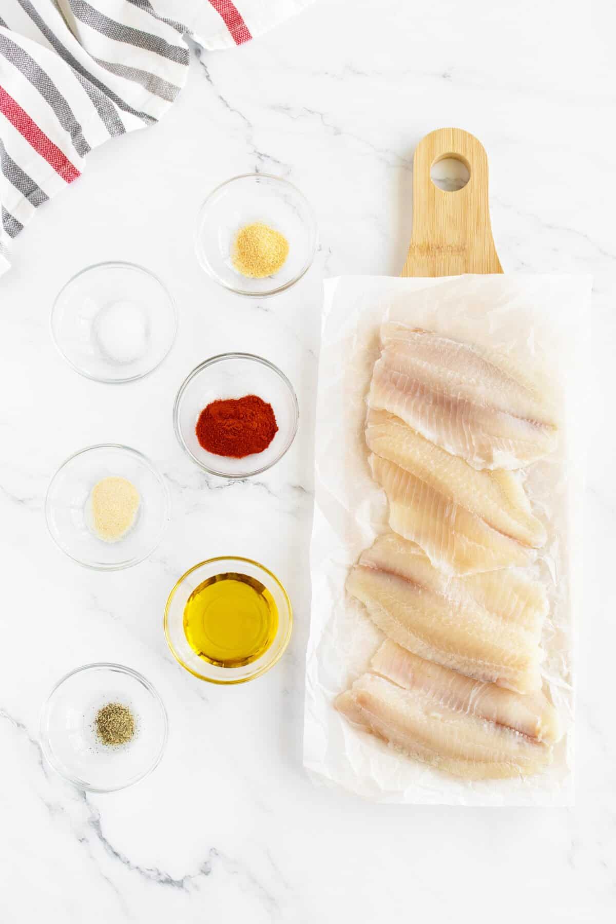 Grilled tilapia ingredients in small bowls