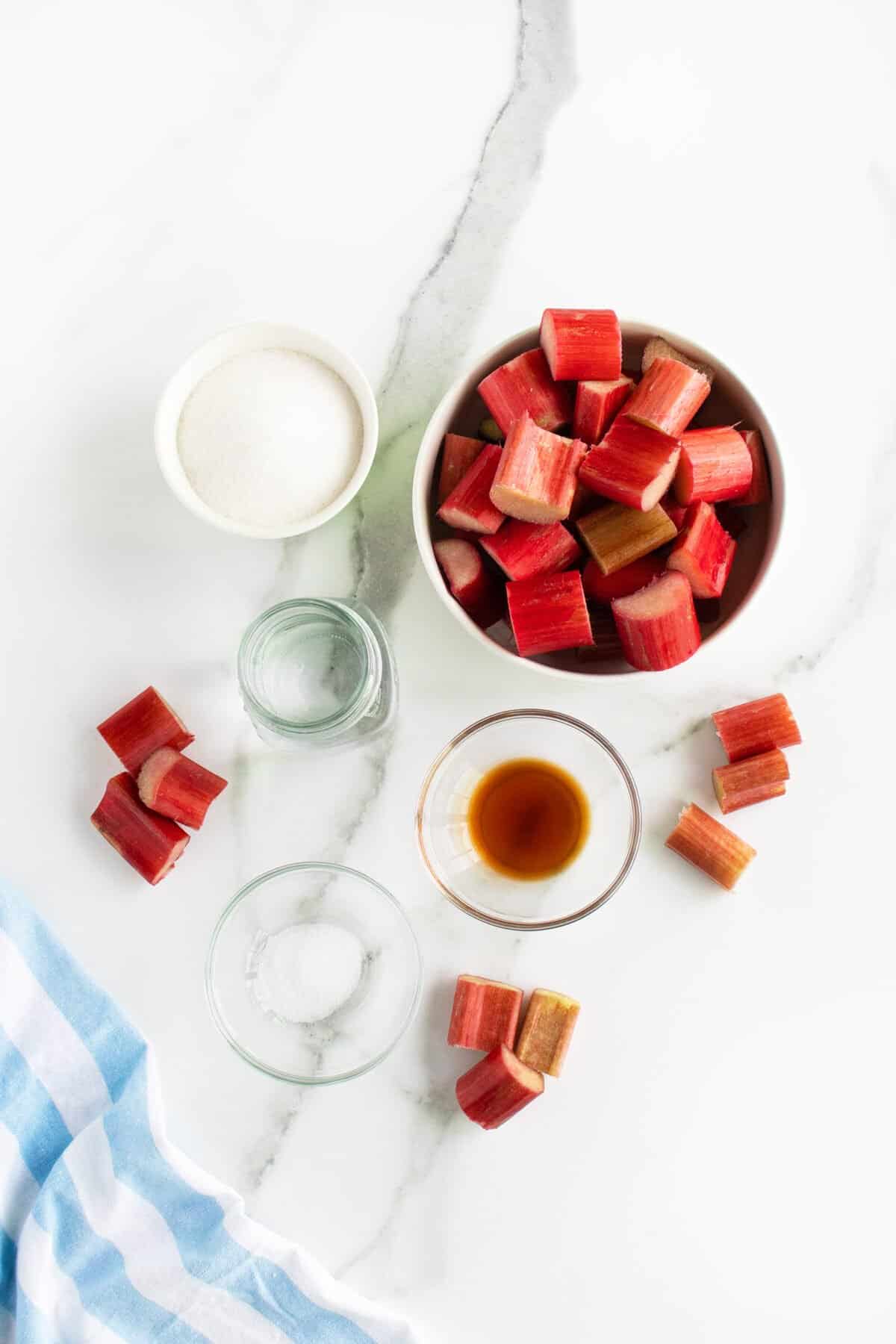 Rhubarb Sauce ingredients on a marble surface