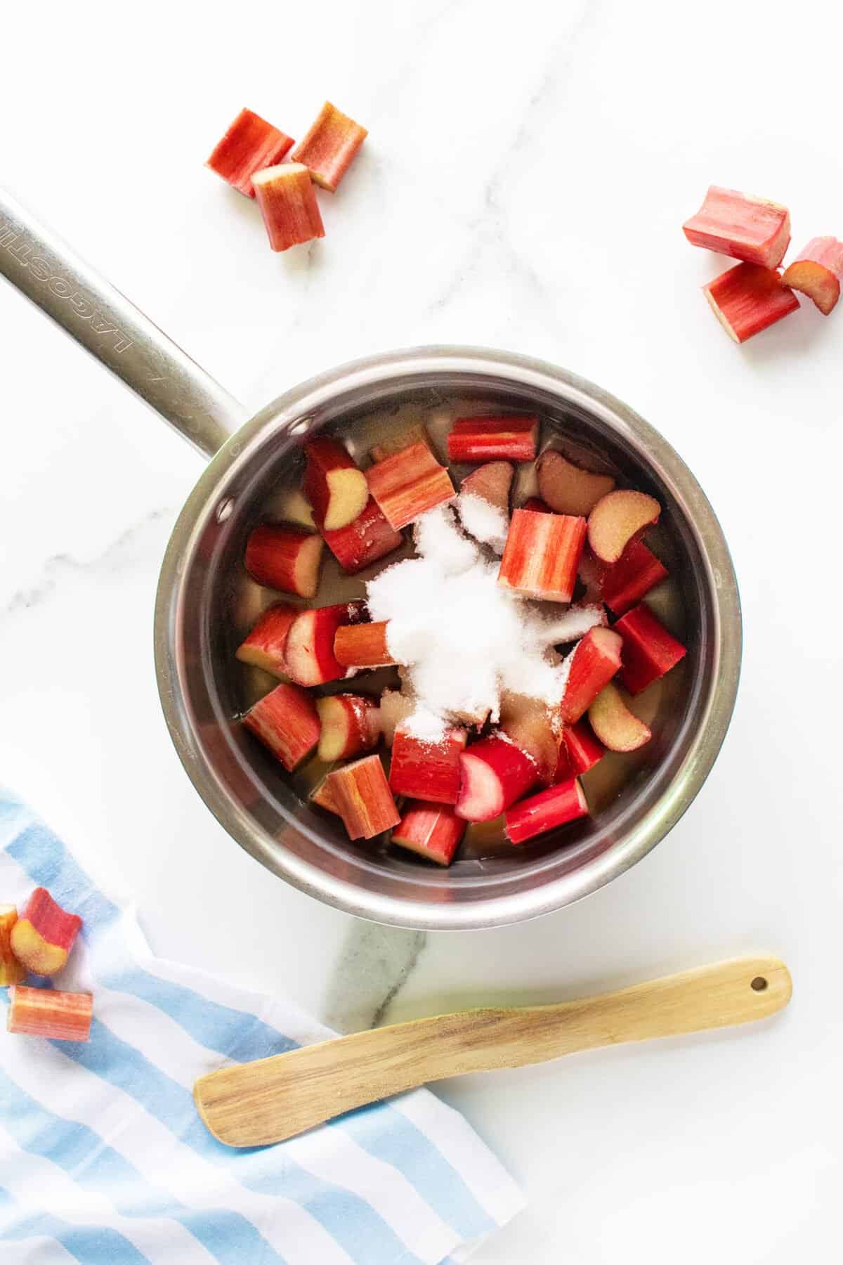 Rhubarb Sauce in a pot with sugar on top