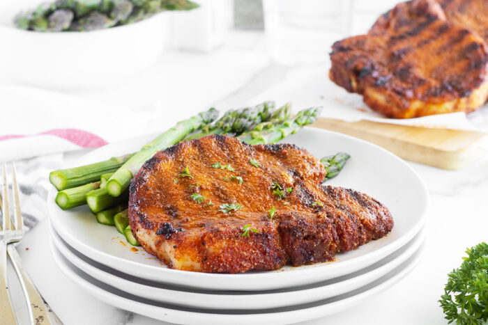 Grilled Pork Chops on a plate with asparagus