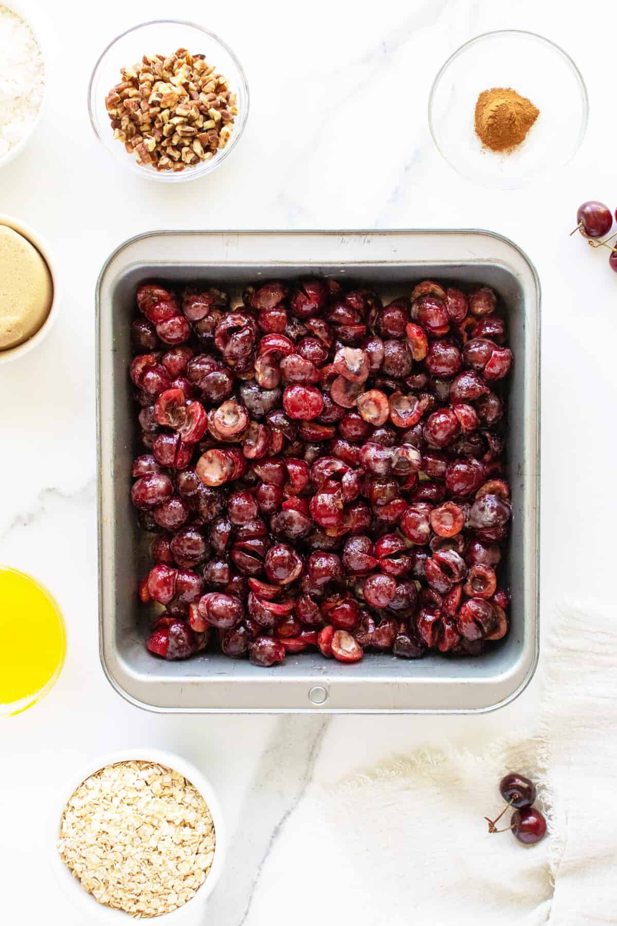 Easy Cherry Crisp cherries in a baking pan