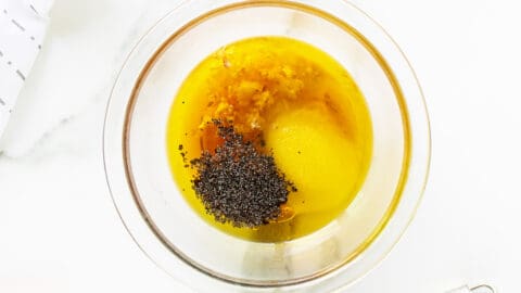 poppy seed dressing in a clear bowl not mixed