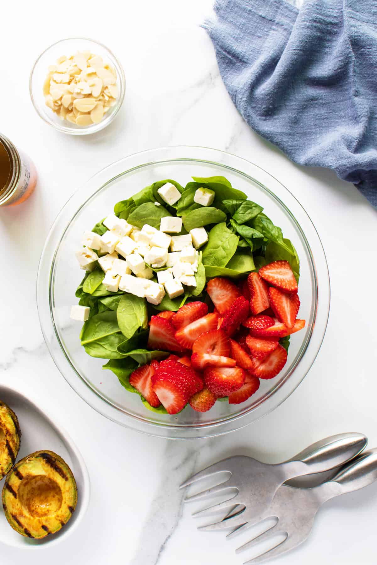 Strawberry spinach salad in process