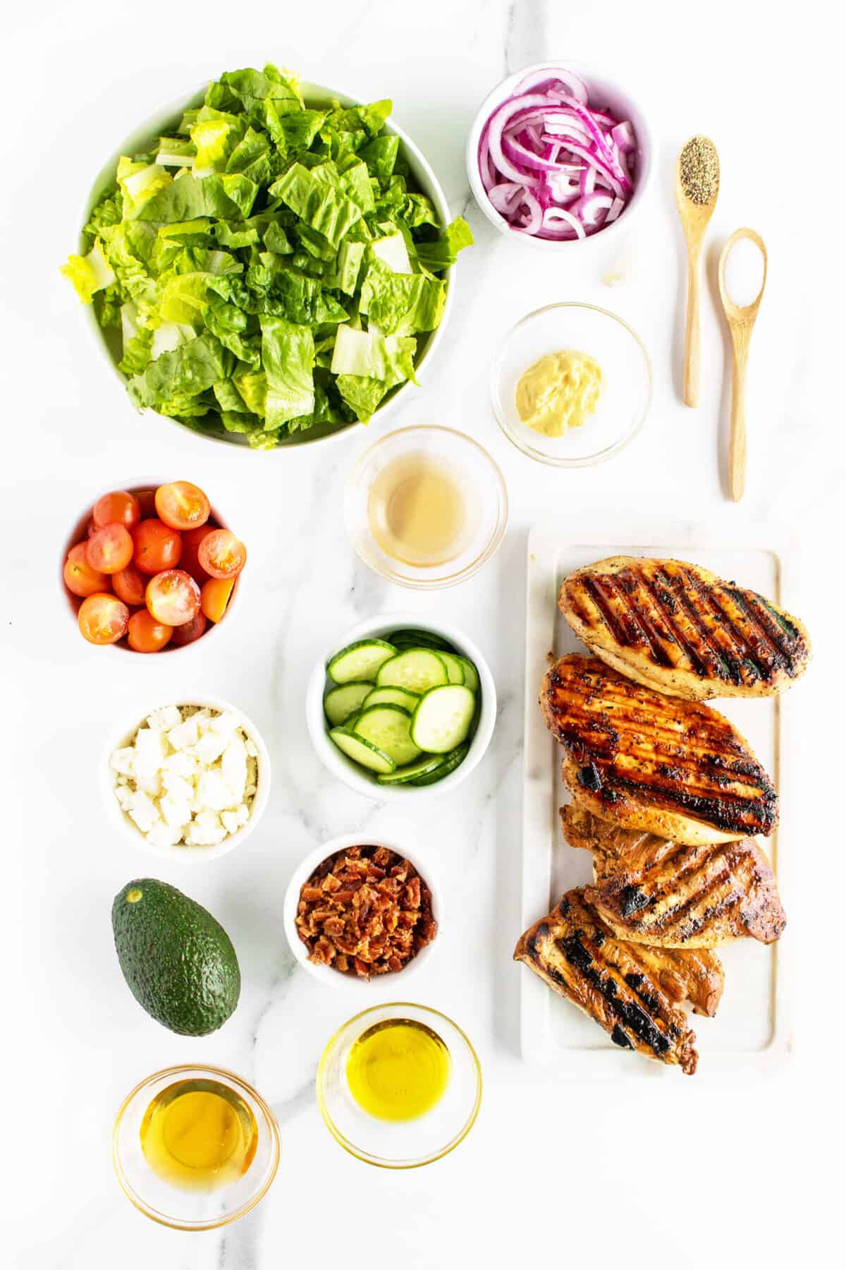 grilled chicken salad ingredients on a white board