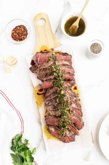 grilled hanger steak sliced on a cutting board