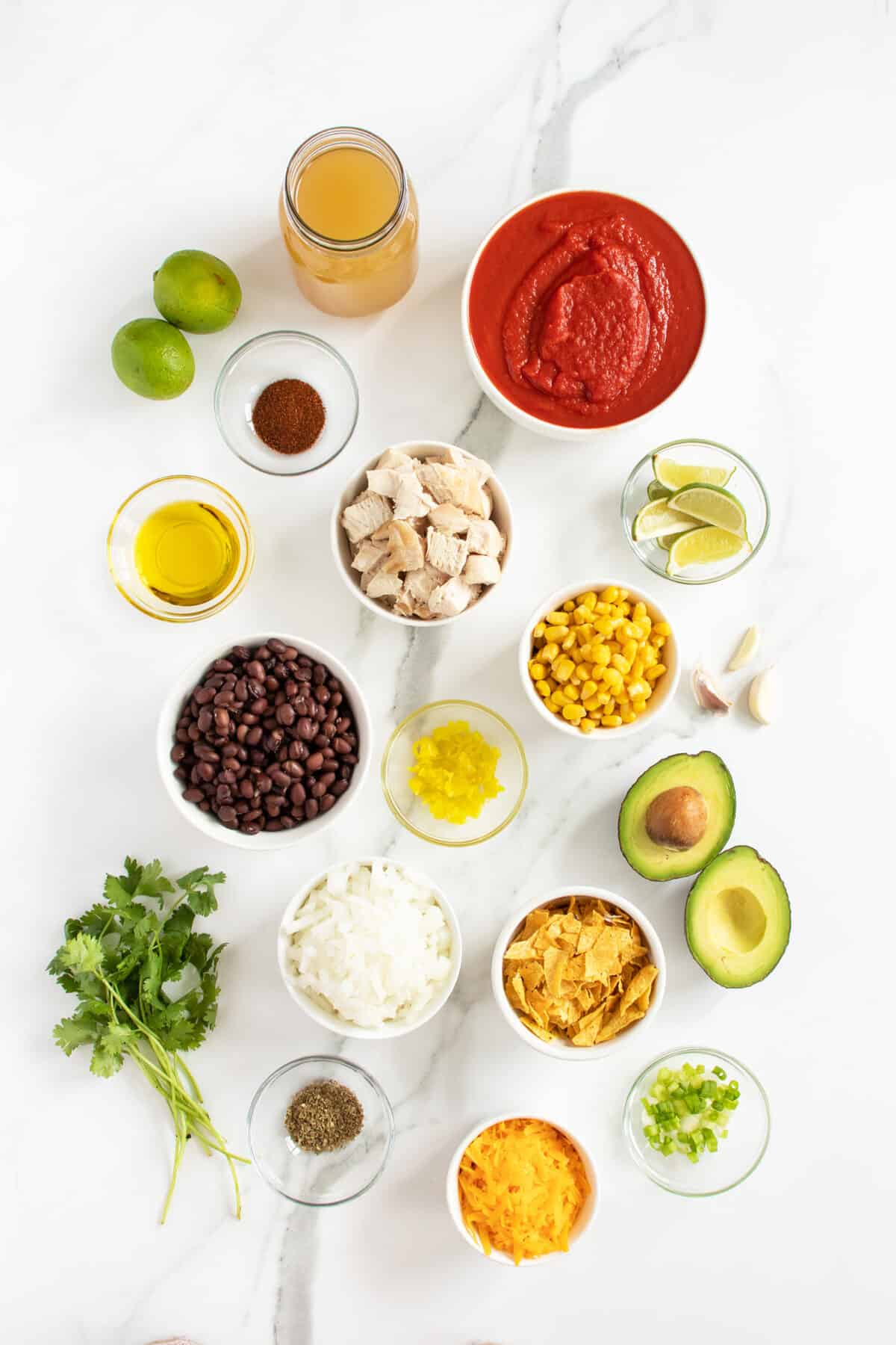 Chicken tortilla soup ingredients in small bowls