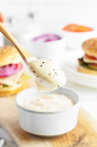 Garlic Aioli on a large wooden spoon