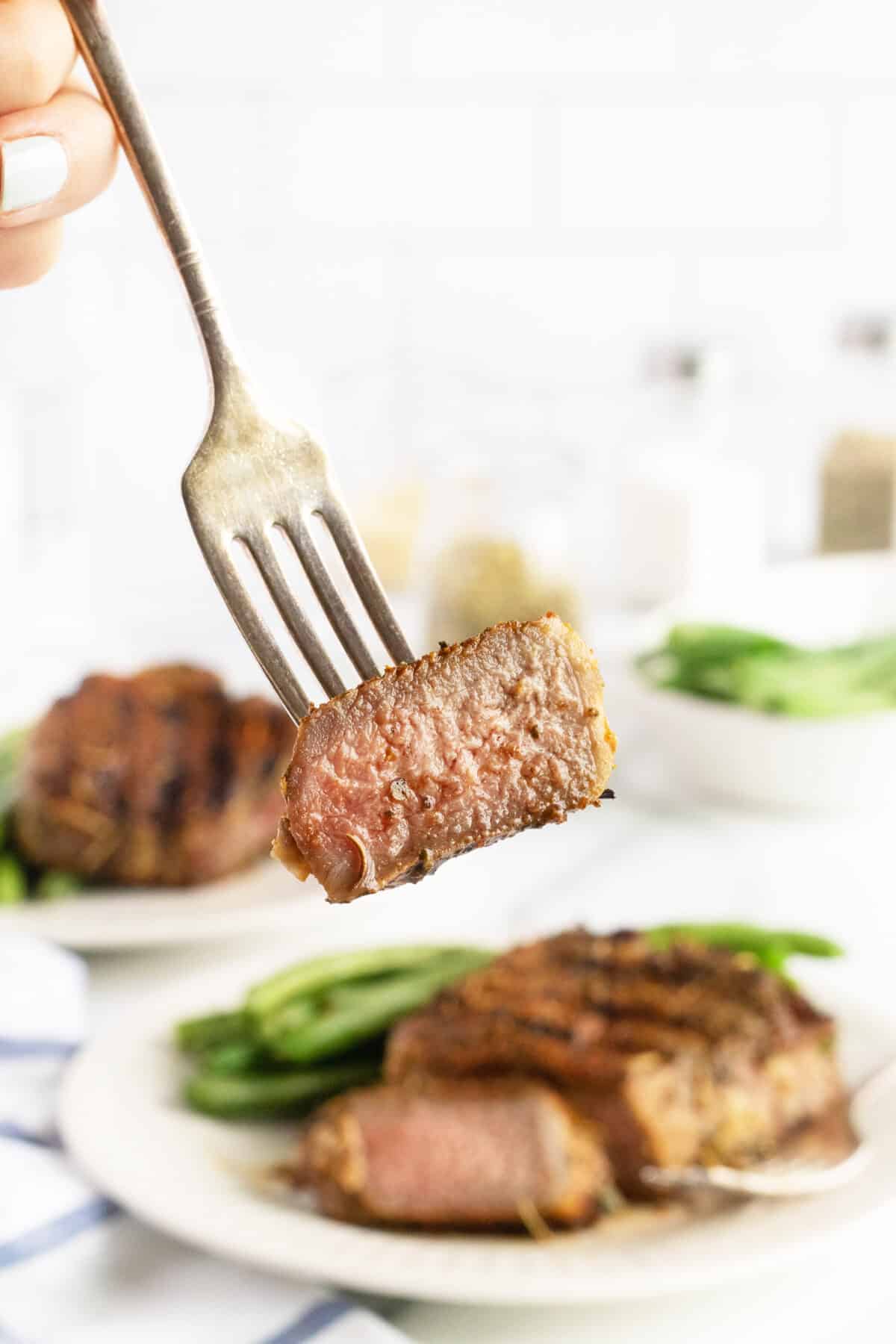 Grilled lamb chops slice on a fork