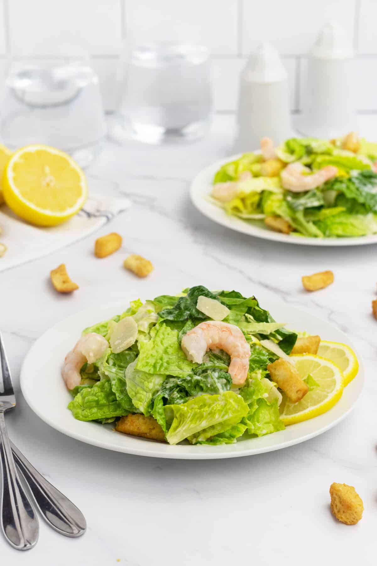 two plates of Shrimp Caesar Salad