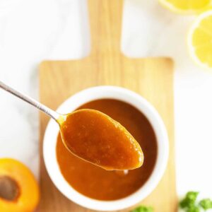 apricot glaze in a spoon