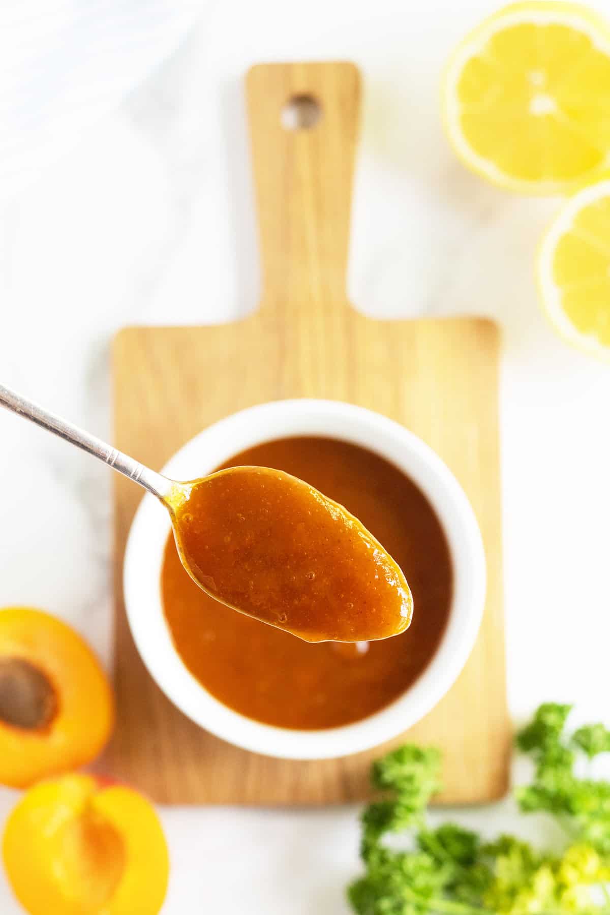 apricot glaze in a spoon