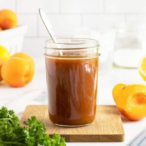 apricot glaze in a mason jar with spoon