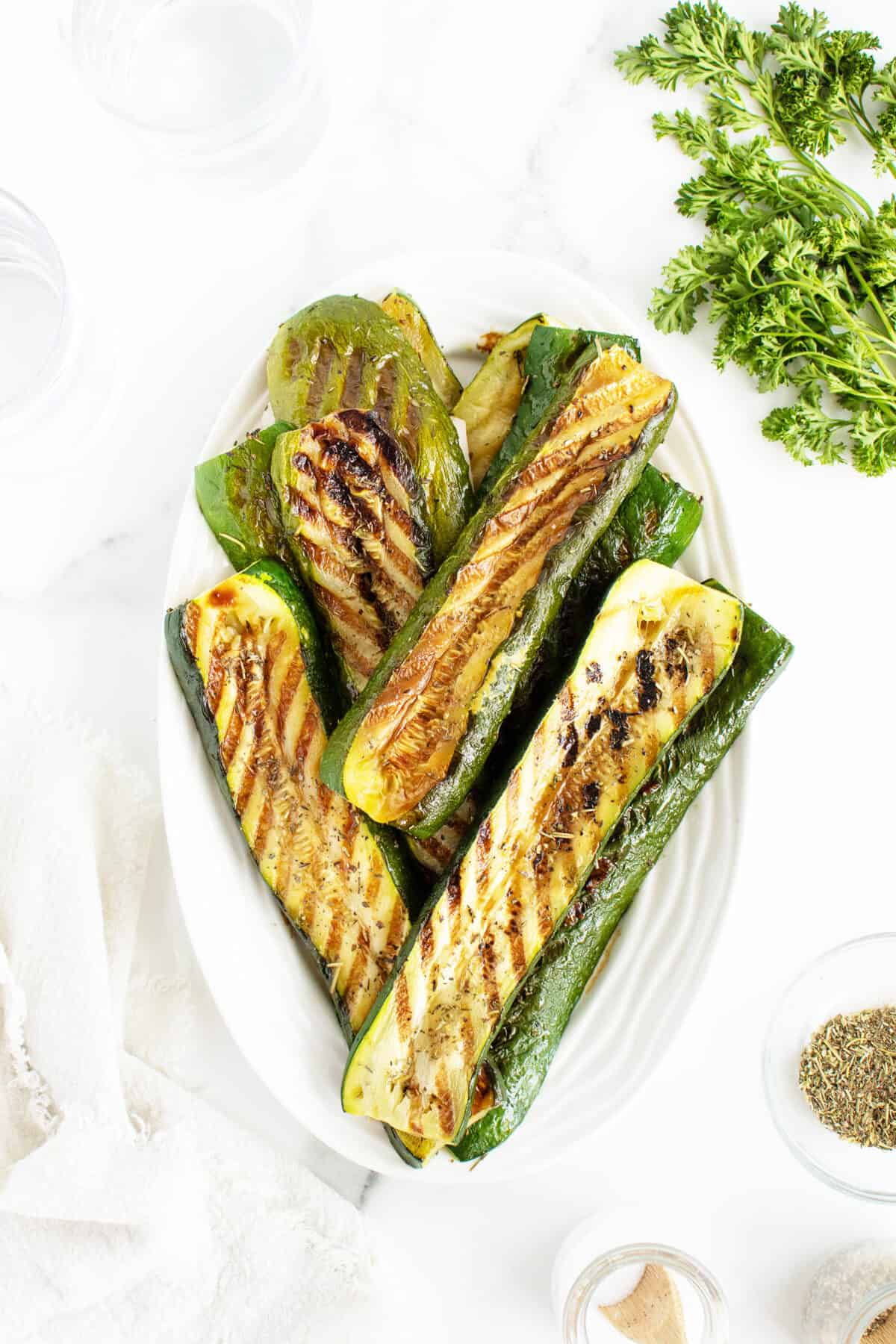 grilled zucchini on a white platter