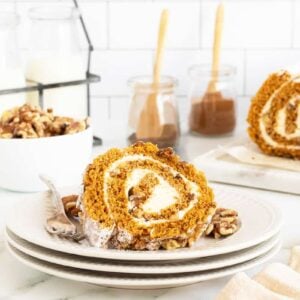 libbys pumpkin roll sliced on a stack of white plates